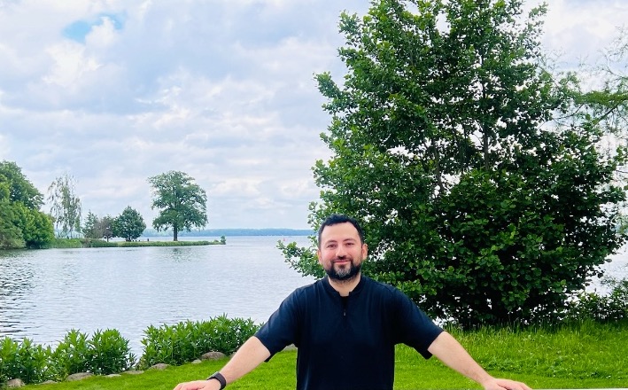 Portrait of Gepser Hoil by a lakeside frame